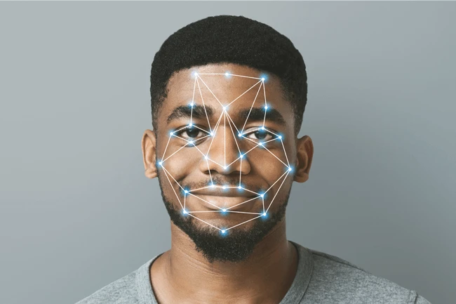 Man's face with digital facial recognition pattern overlay